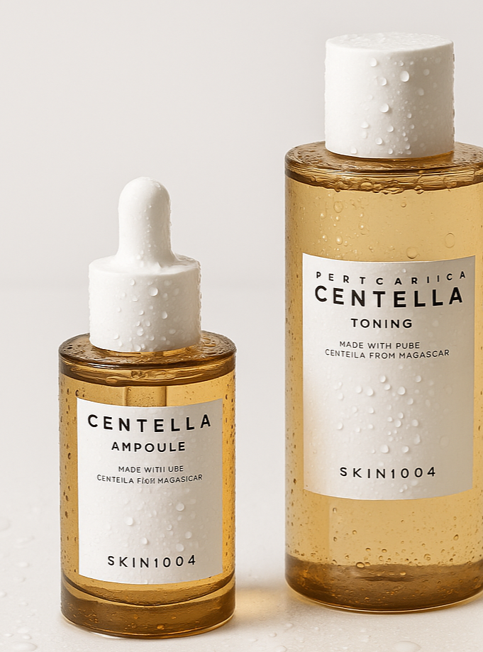centella products by skin1004 slightly wet with water droplets on them arranged on flat surface with plain background